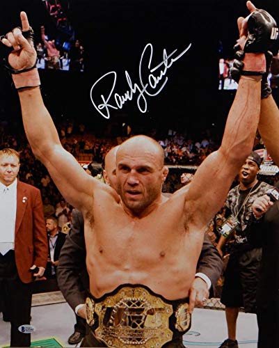 Randy Couture Autographed UFC 16x20 With Belt Photo- Beckett Auth White - 757 Sports Collectibles