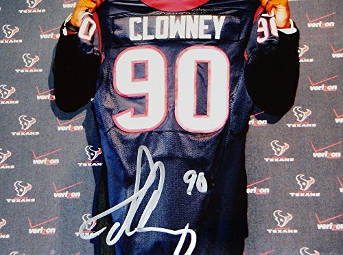 Jadeveon Clowney Autographed 8x10 Holding Texans Jersey Photo- JSA Authenticated - 757 Sports Collectibles