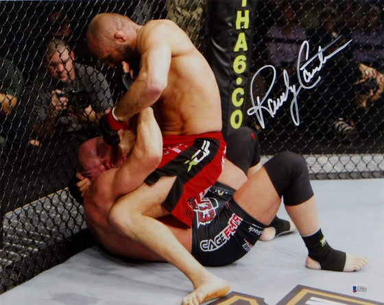 Randy Couture Autographed UFC 16x20 On Top Punching Photo- Beckett Auth White - 757 Sports Collectibles